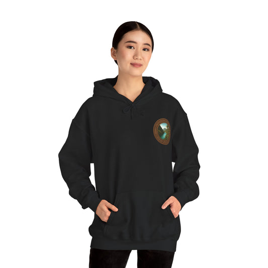Person wearing a black Paparoa Track hoodie with a logo on the chest against a white background