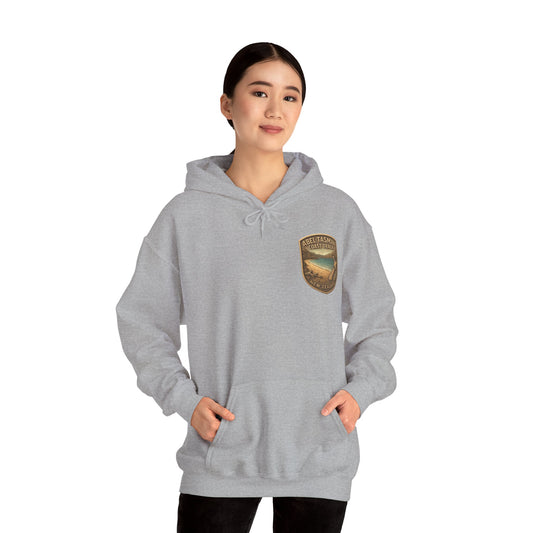 Person wearing a gray Abel Tasman hoodie with a logo on a white background