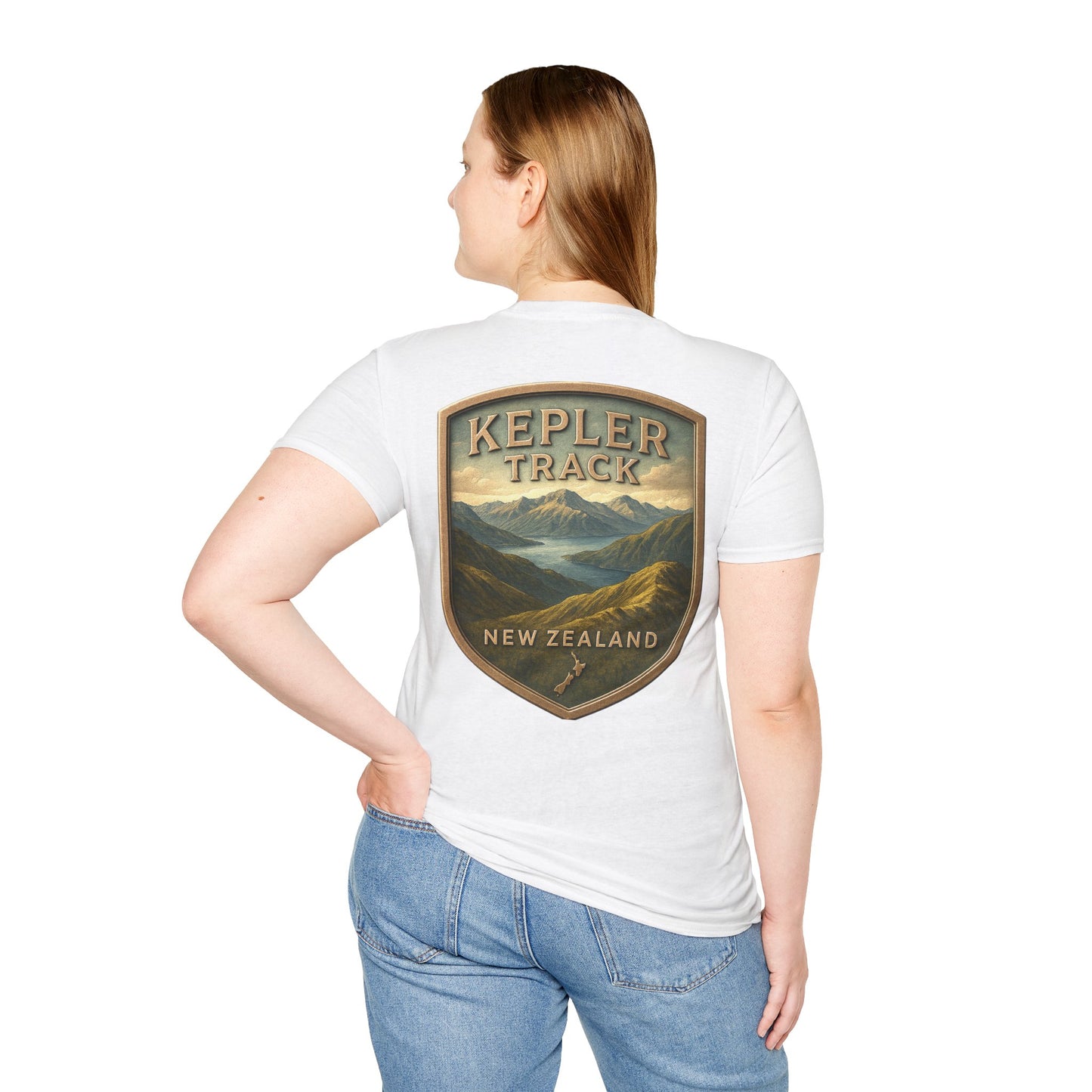Person wearing a white t-shirt with 'Kepler Track New Zealand' graphic on the back.