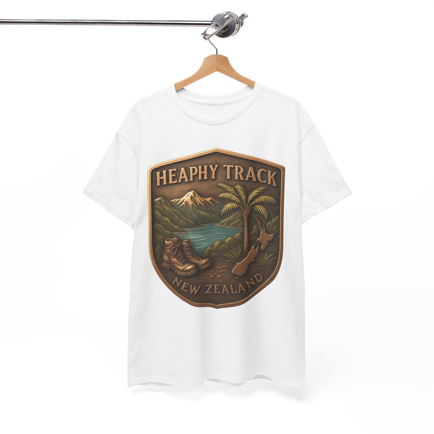 White t-shirt with a 'Heaphy Track New Zealand' graphic on a hanger against a white background