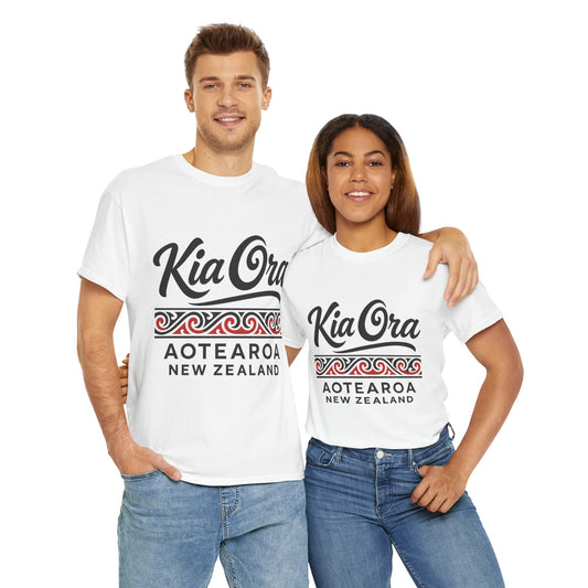 Two people wearing white t-shirts with 'Kia OrA Aotearoa New Zealand' text on a white background
