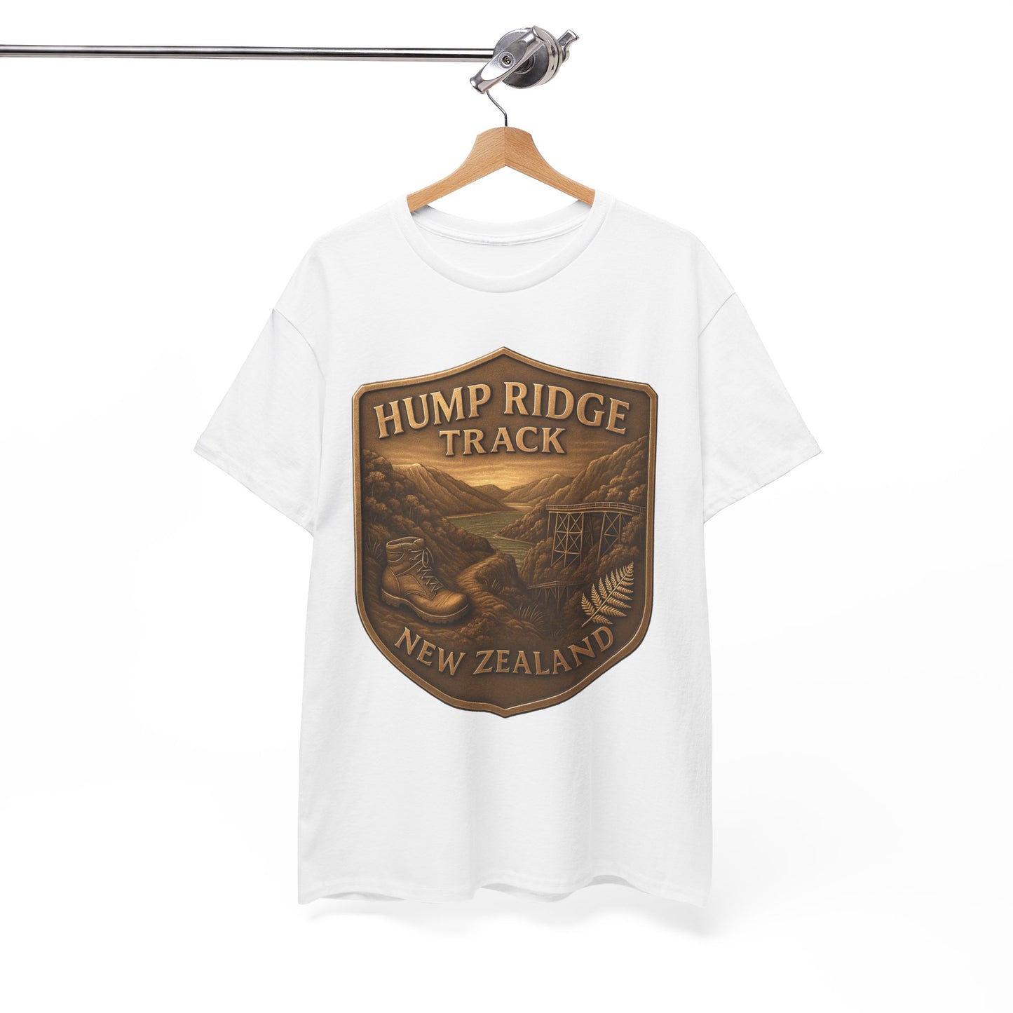 White t-shirt with 'Hump Ridge Track, New Zealand' graphic on a hanger against a white background