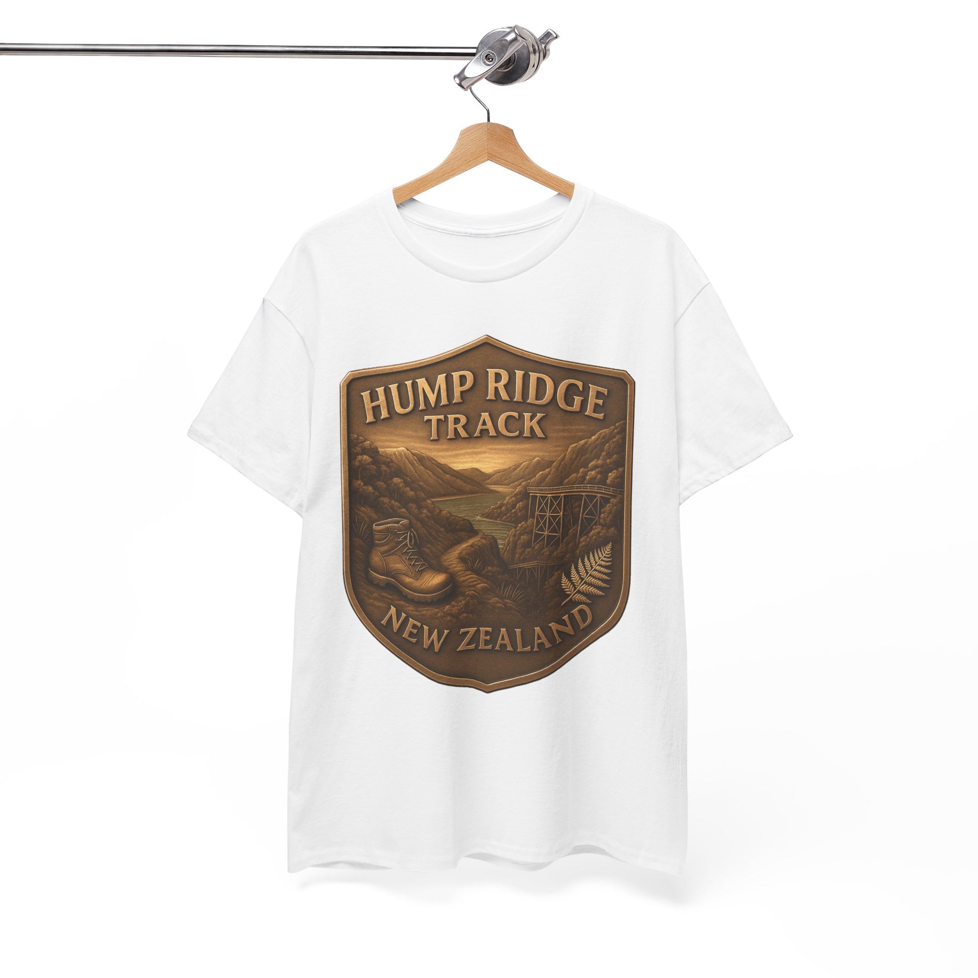 White t-shirt with 'Hump Ridge Track, New Zealand' graphic on a hanger against a white background