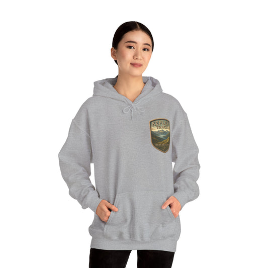 Person wearing a gray Kepler Track hoodie with a logo on a white background