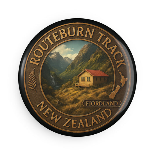 Round Fridge Magnet badge with Routeburn Track New Zealand design featuring a cabin and mountains.
