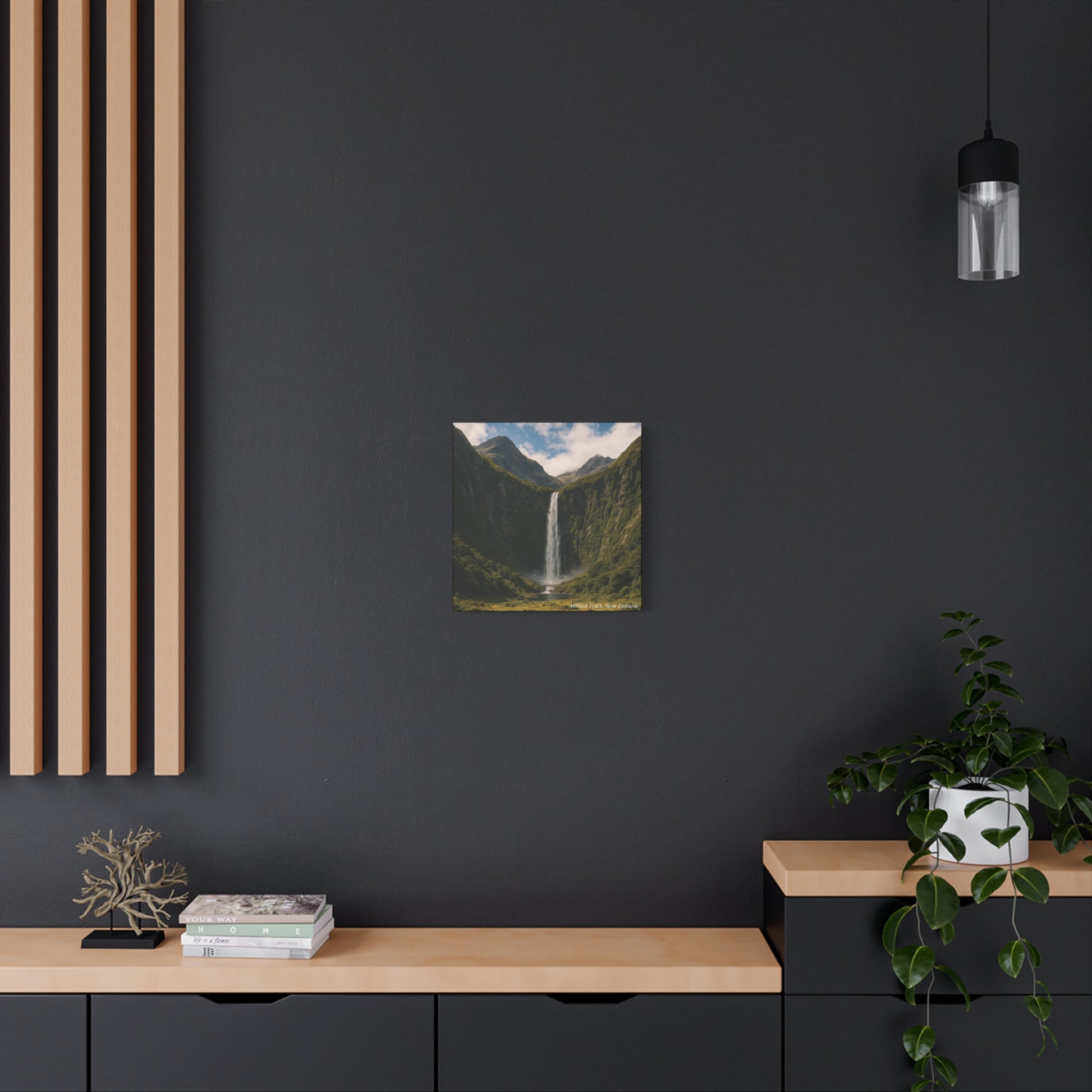 Modern interior with a dark wall, wooden shelf, and painting of a mountain landscape.