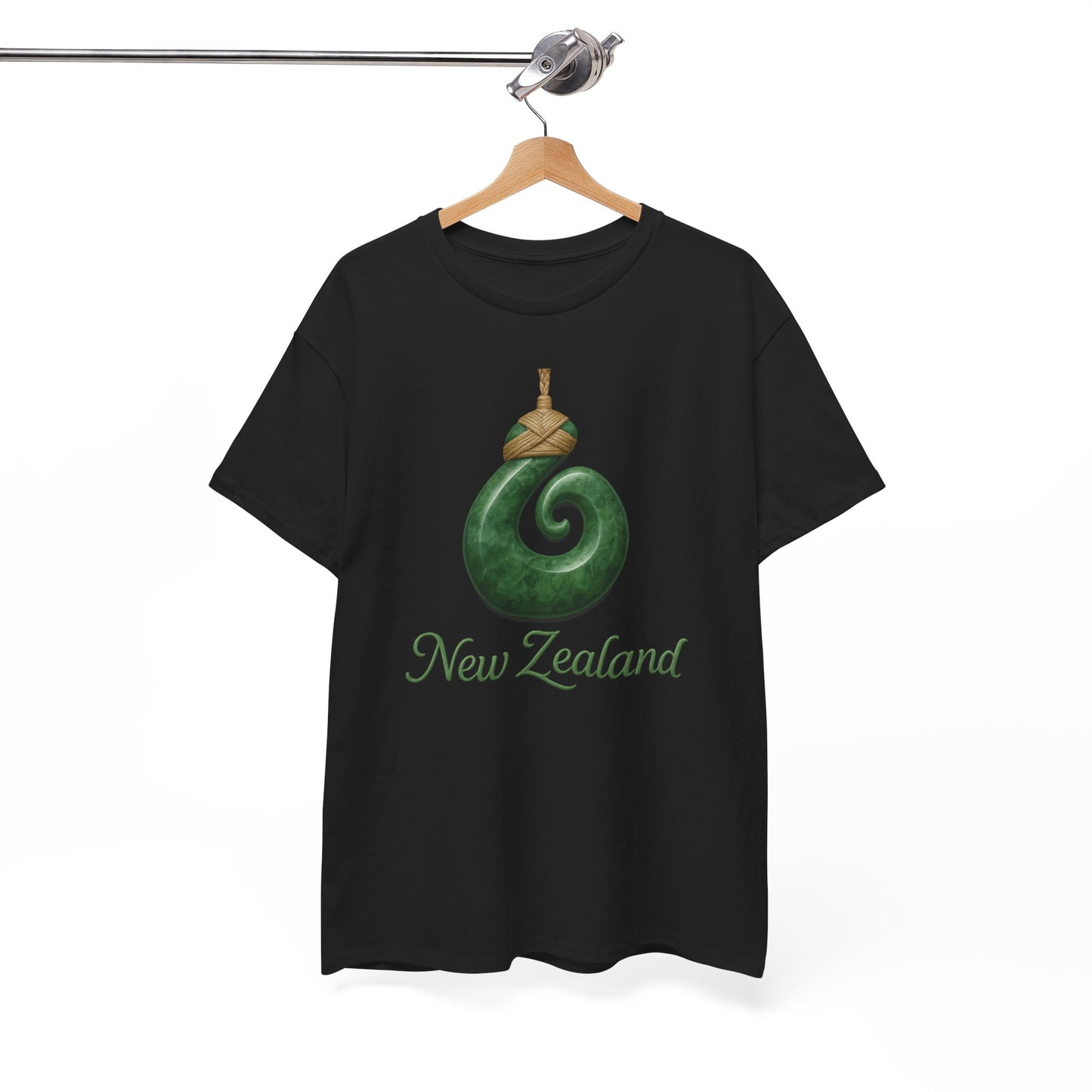Black t-shirt with green spiral design and 'New Zealand' text on a hanger against a white background