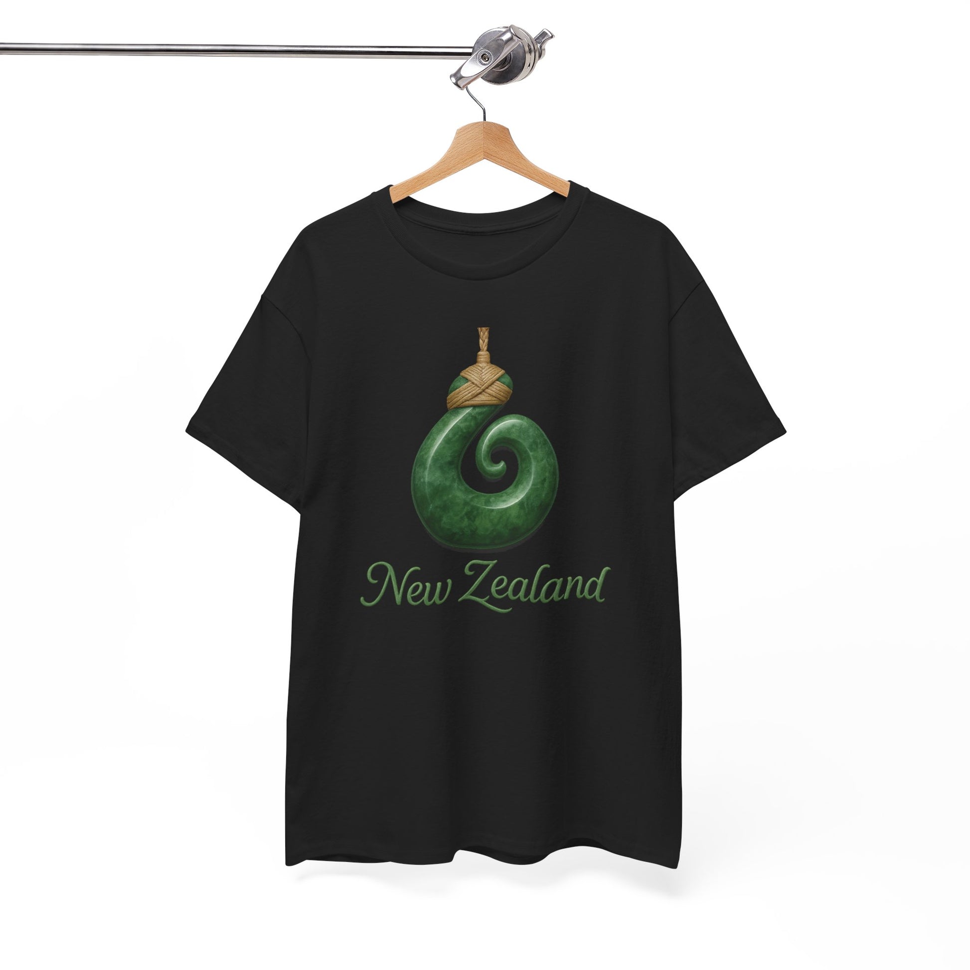 Black t-shirt with green spiral design and 'New Zealand' text on a hanger against a white background