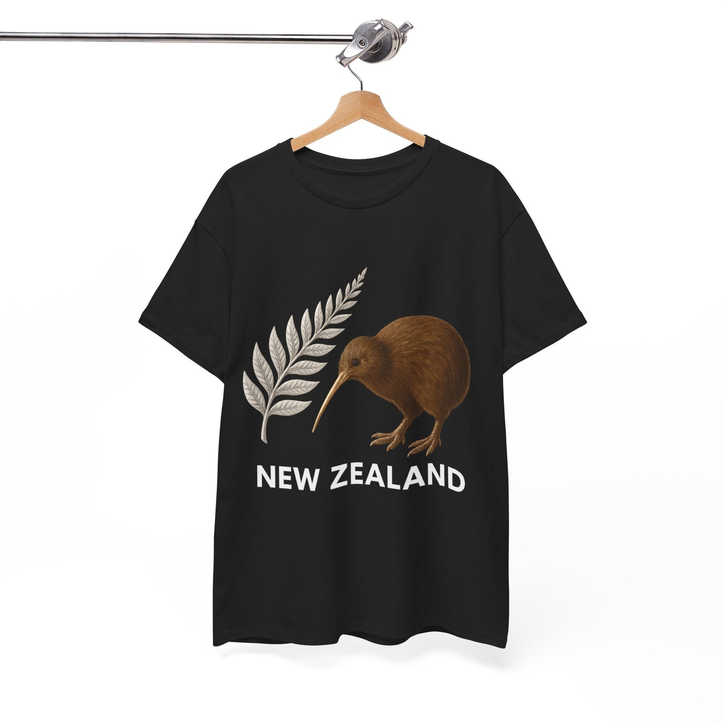 Black t-shirt with a kiwi bird and silver fern leaf design on a hanger against a white background