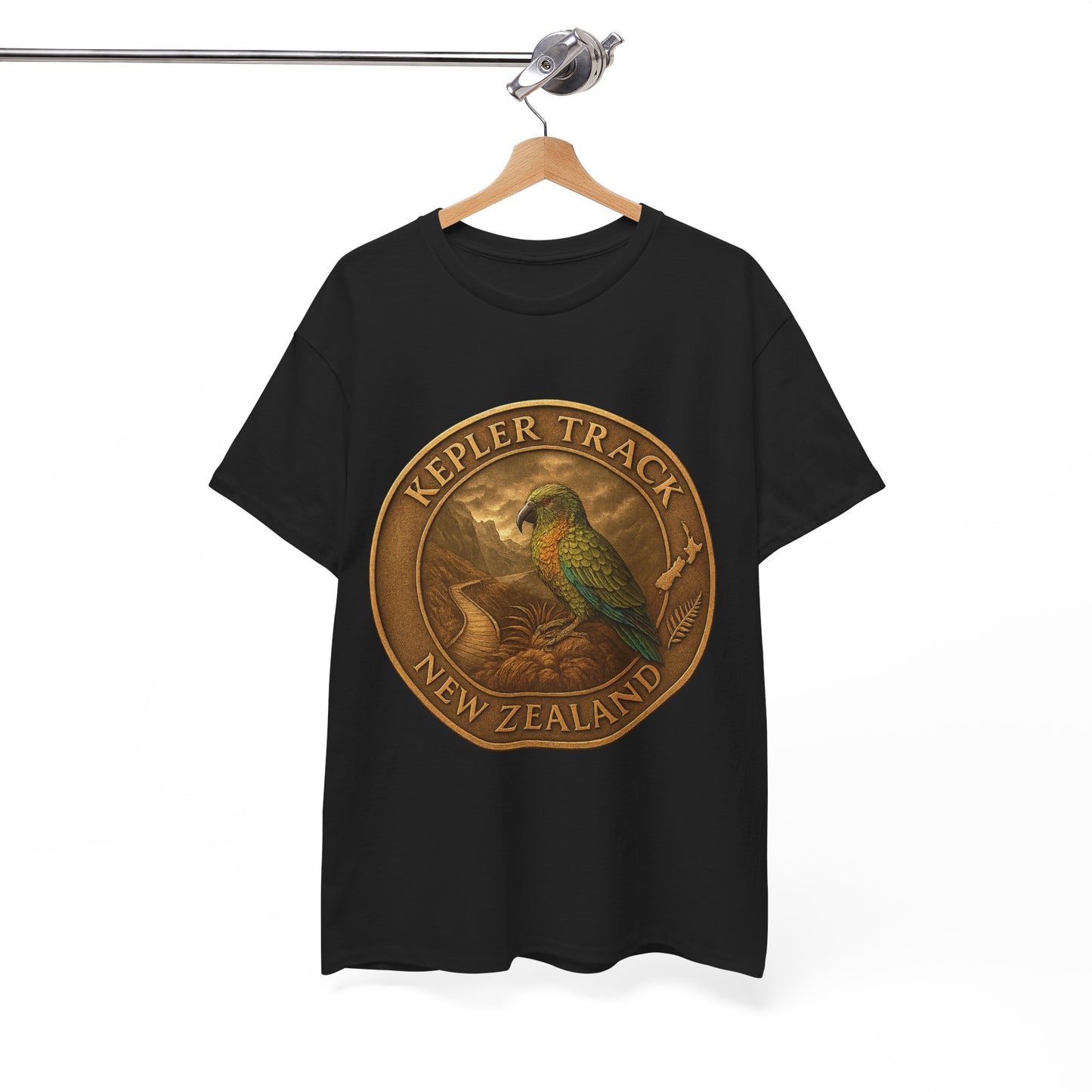 Black t-shirt with a gold emblem featuring a parrot and 'Kepler Track New Zealand' text on a hanger.