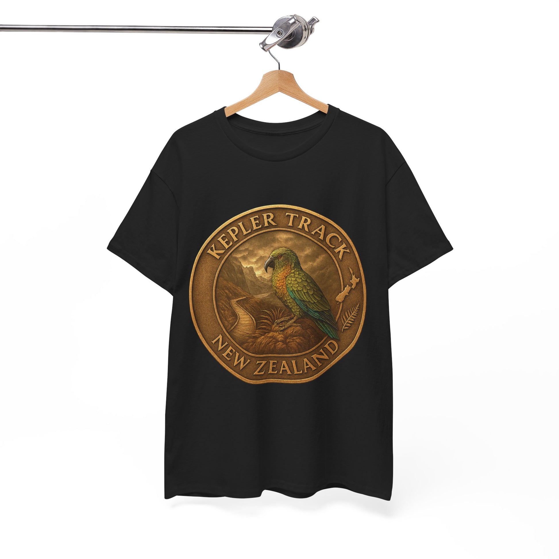Black t-shirt with a gold emblem featuring a parrot and 'Kepler Track New Zealand' text on a hanger.