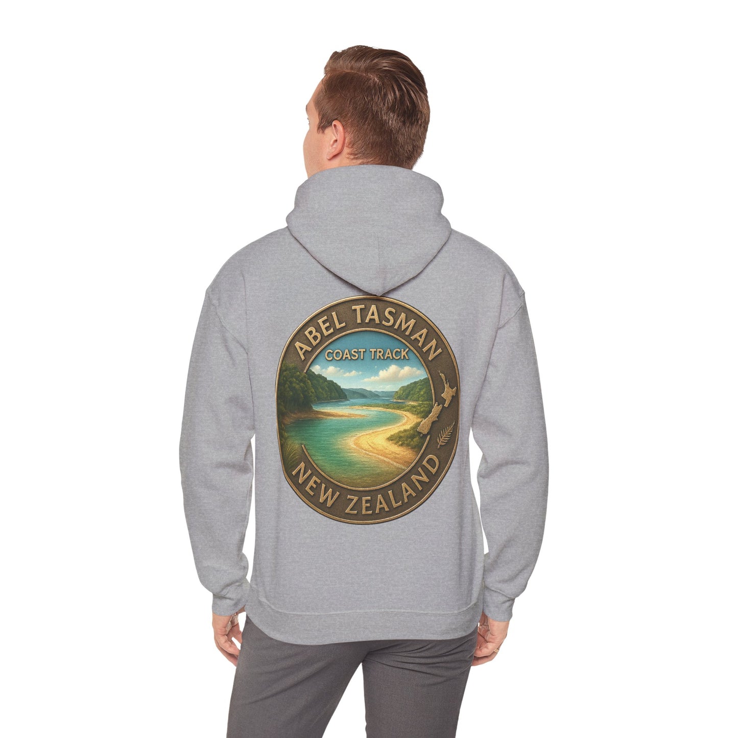 Person wearing a gray hoodie with Abel Tasman Coast Track New Zealand design on the back