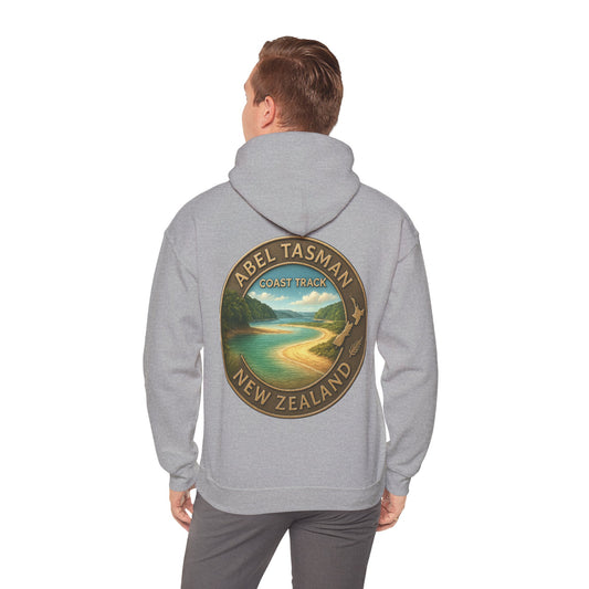 Person wearing a gray hoodie with Abel Tasman Coast Track New Zealand design on the back