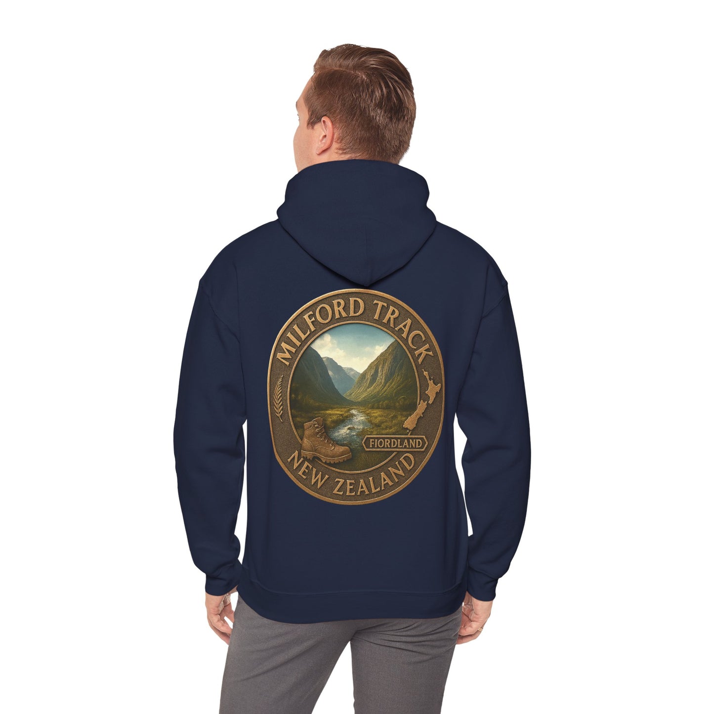 Navy blue hoodie with Milford Track New Zealand design on the back, worn by a person.