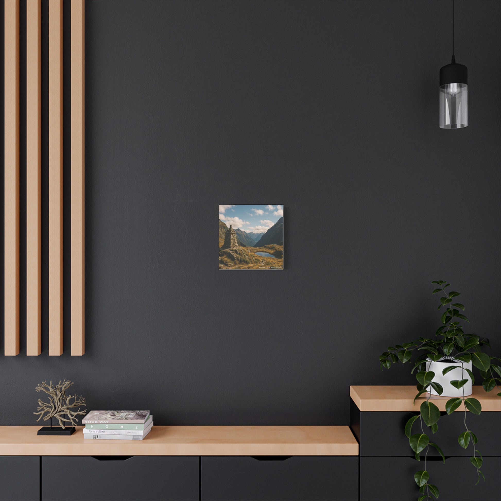 Modern interior with a dark wall, wooden shelf, and landscape painting.