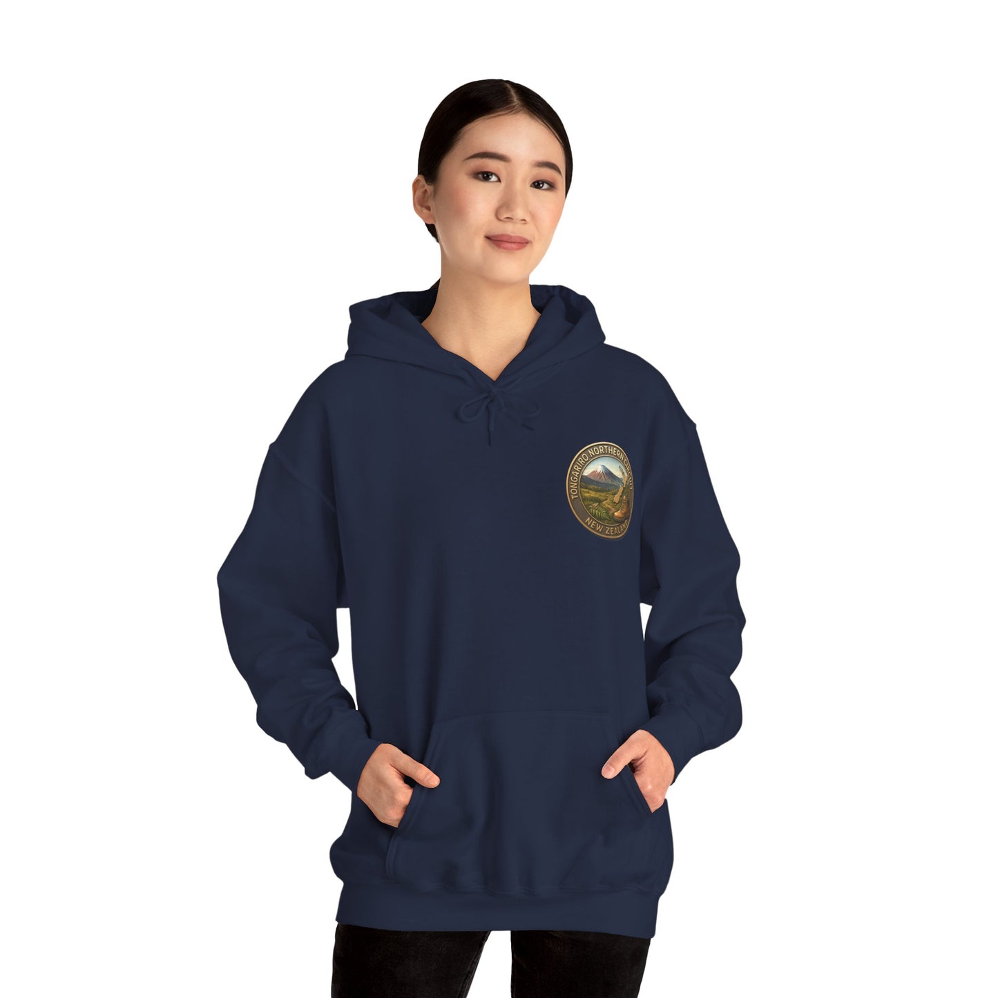 Person wearing a navy blue Tongariro Northern Circuit hoodie with a logo on a white background