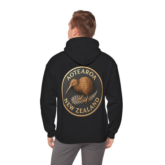 Black hoodie with 'Aotearoa New Zealand' design on the back, worn by a person.