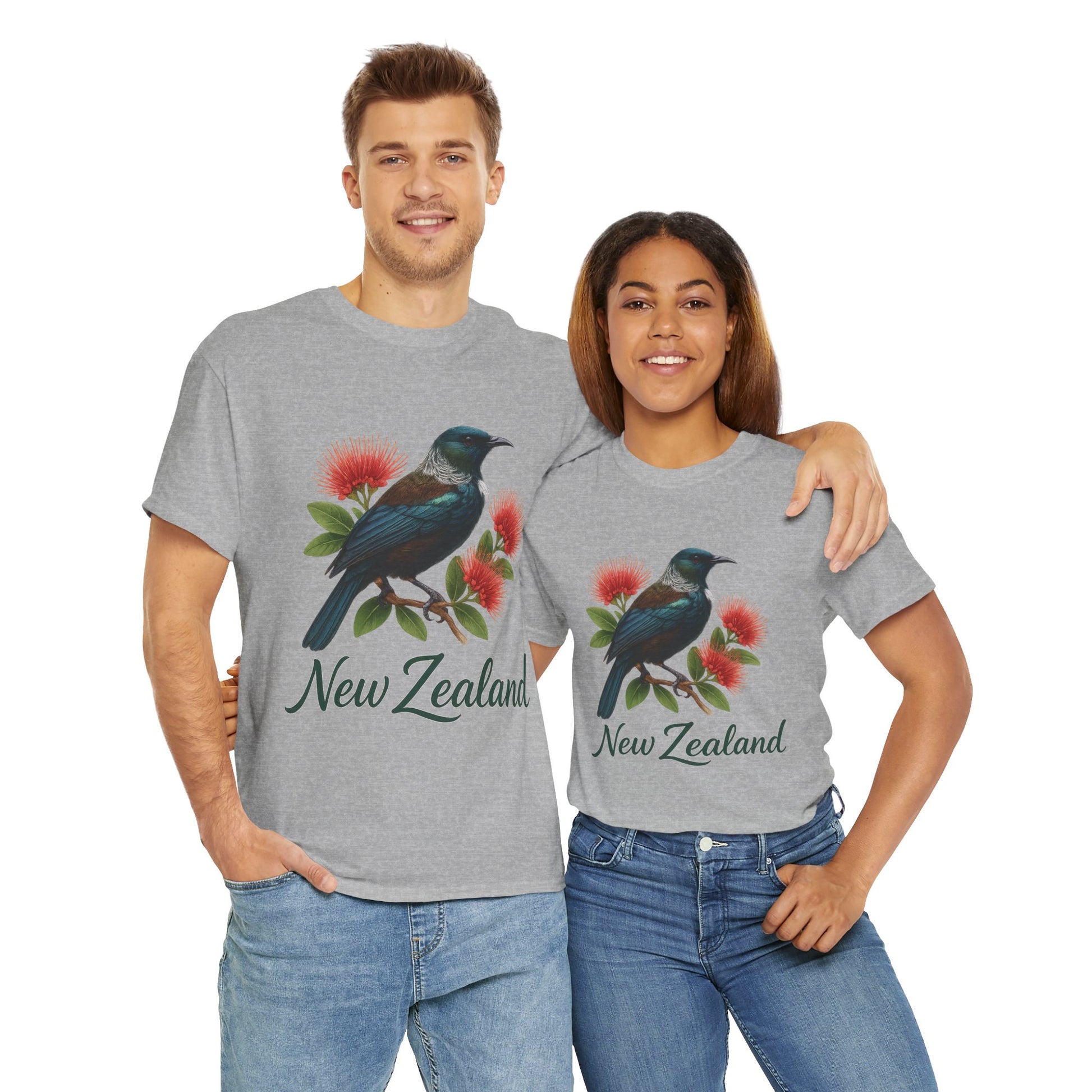 Two people wearing gray t-shirts with a bird and flower design and 'New Zealand' text.