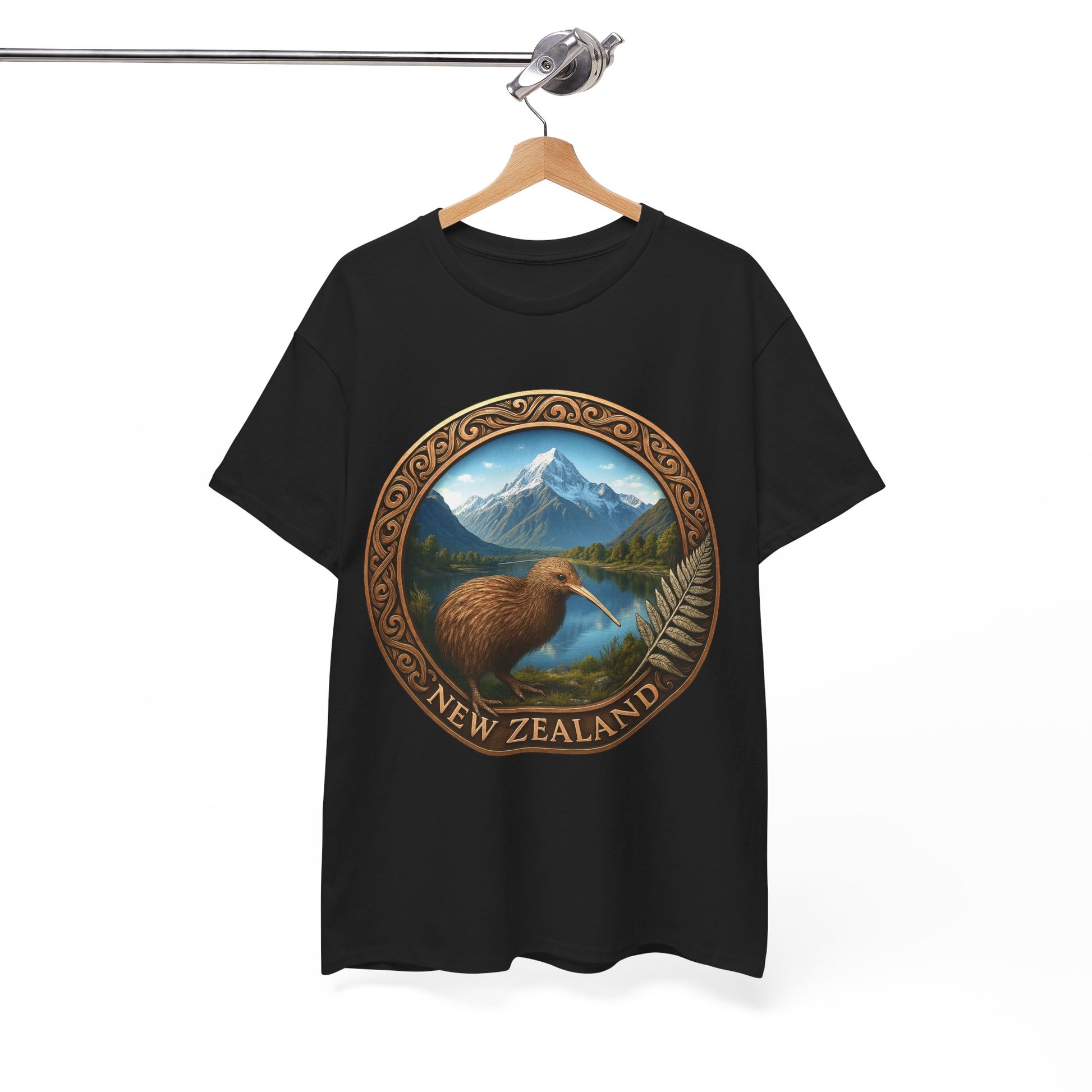 Black t-shirt with New Zealand design featuring a kiwi bird and mountains on a hanger against a white background.