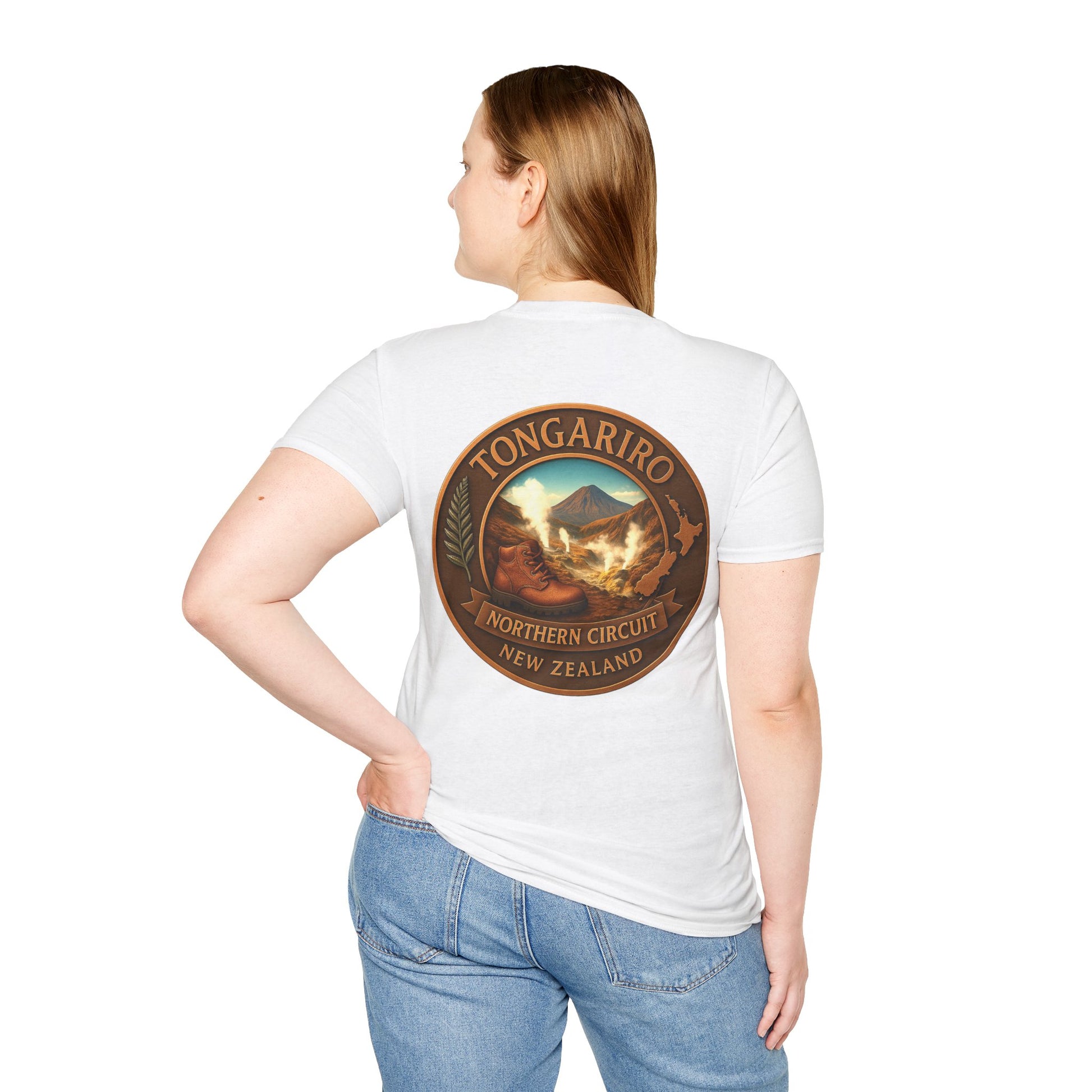 Person wearing a white Tongariro Northern Circuit t-shirt with a scenic design on the back, standing against a plain background.