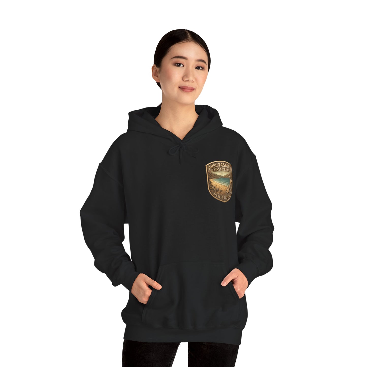 Person wearing a black Abel Tasman hoodie with a logo on a white background