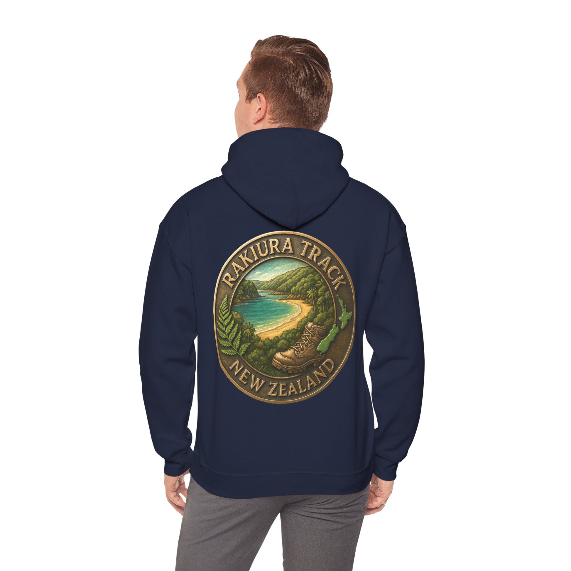 Navy blue hoodie with a 'Rakiura Track, New Zealand' design on the back, worn by a person.