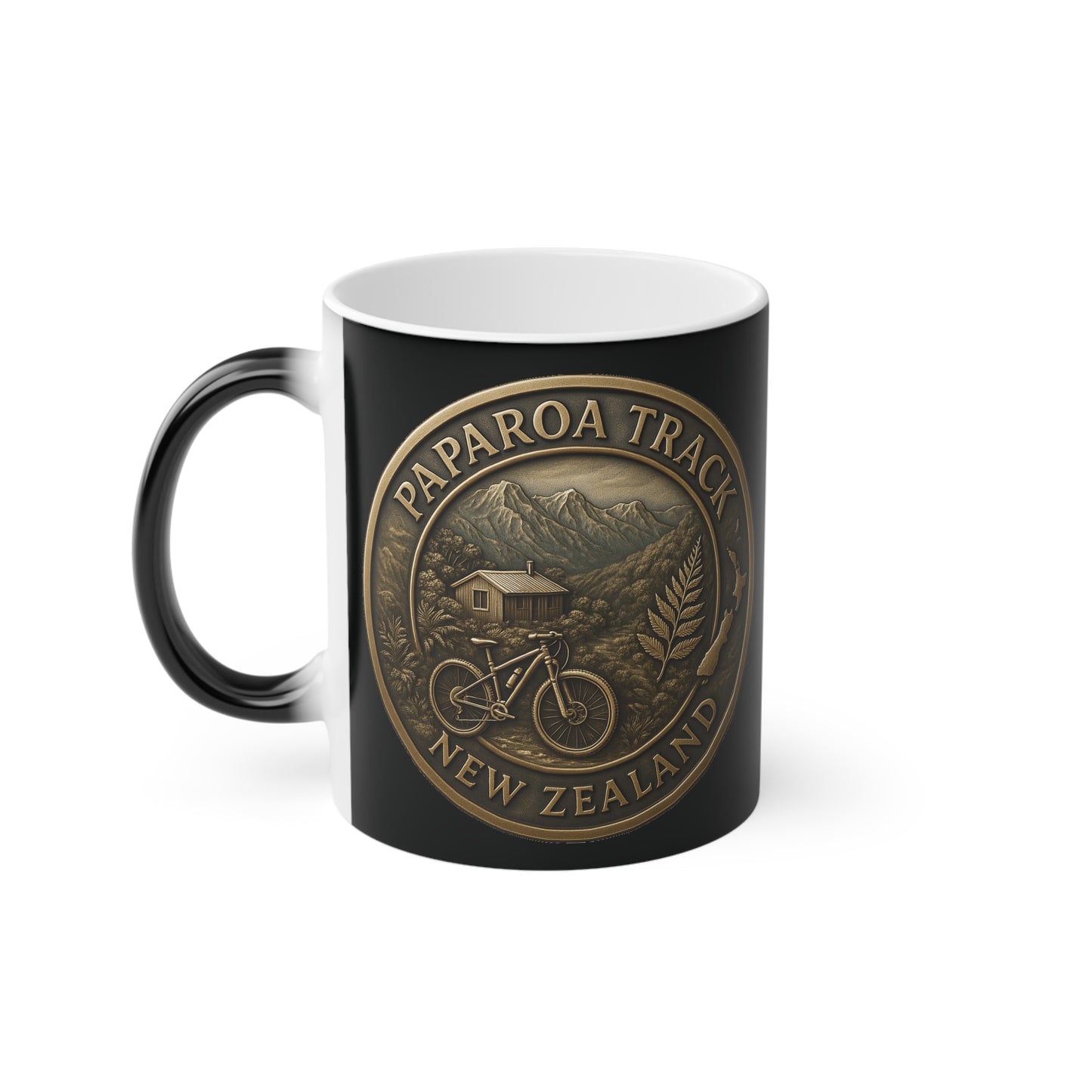 Black mug with Paparoa Track New Zealand design featuring a bicycle and mountain landscape.