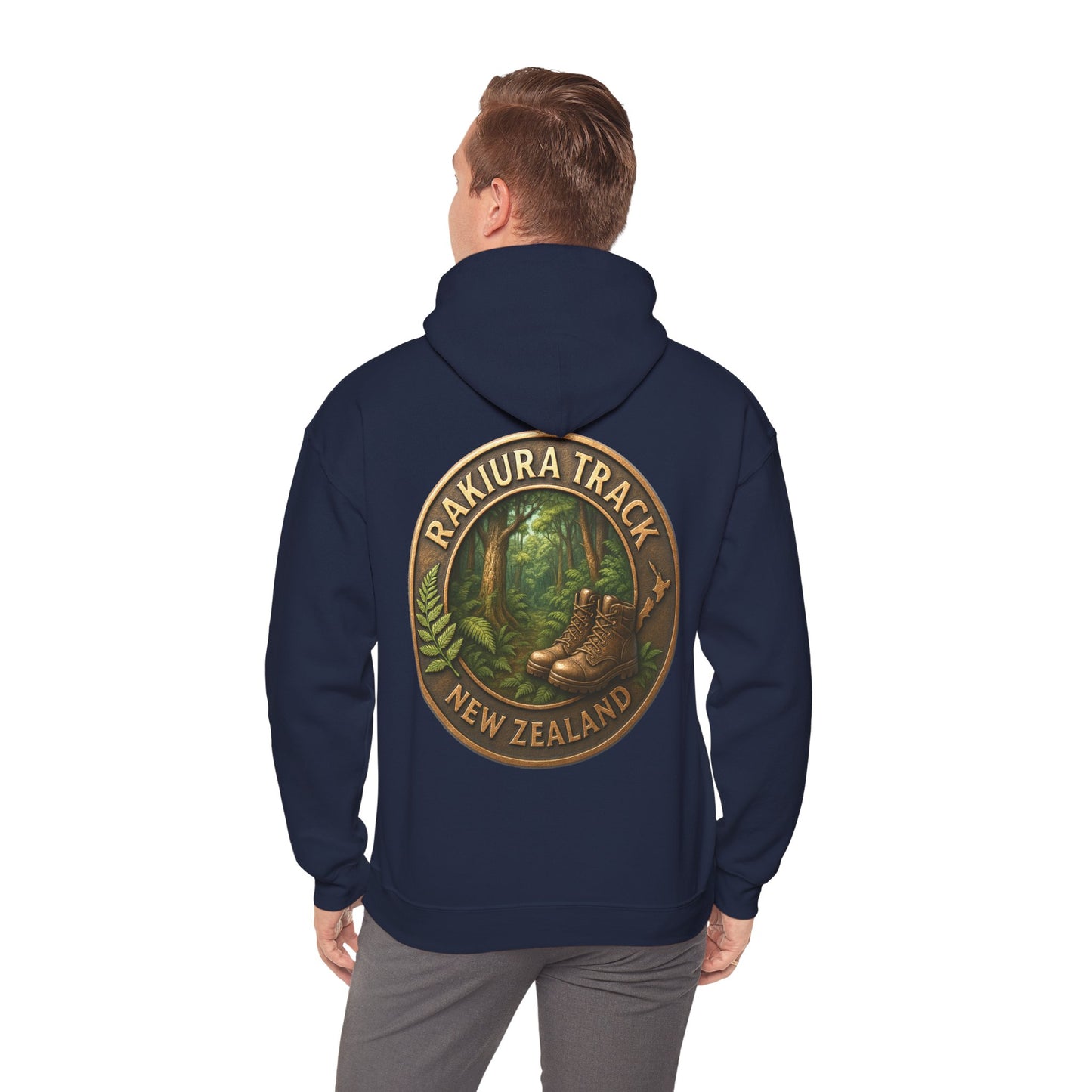 Person wearing a navy hoodie with a Rakiura Track New Zealand design on the back.