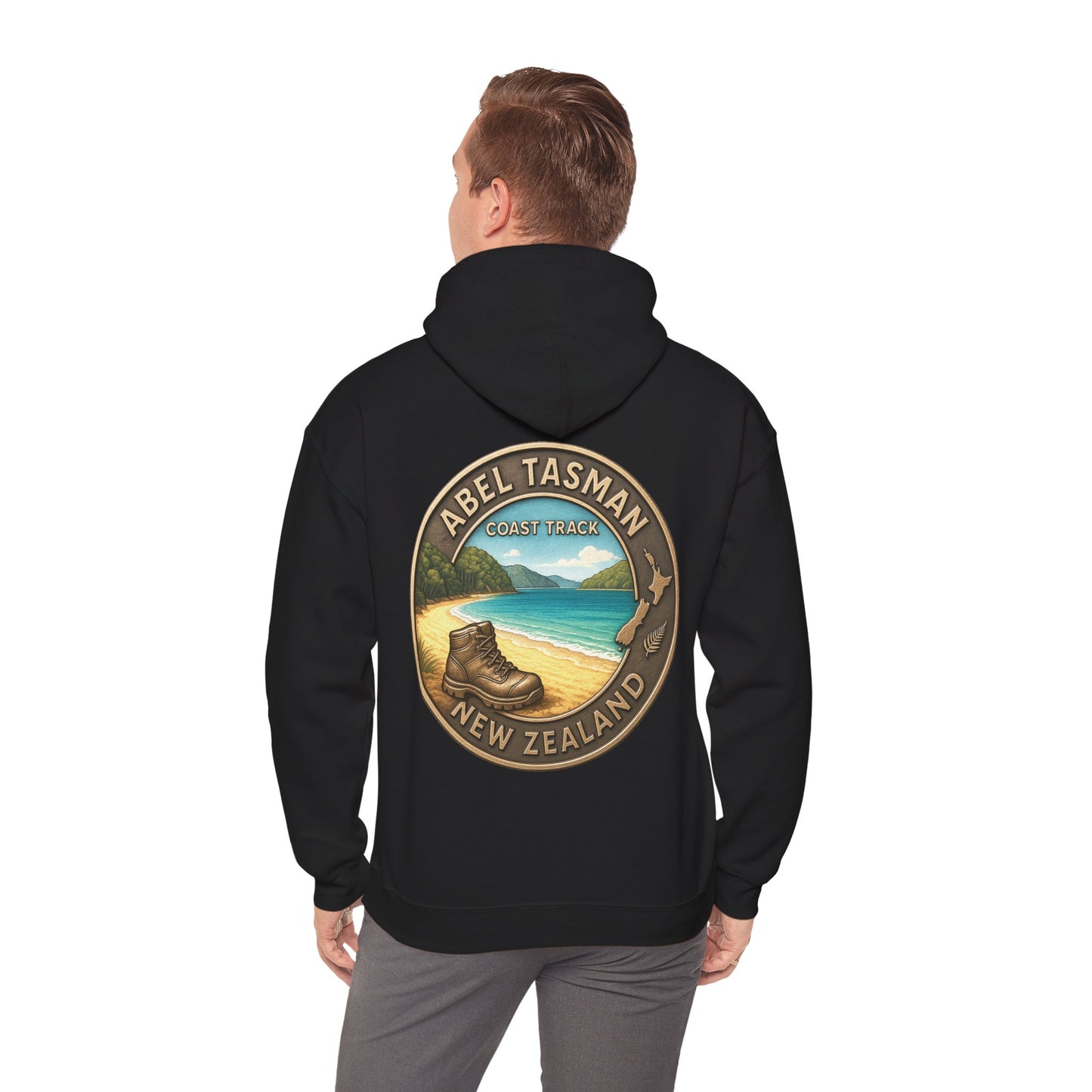 Black hoodie with Abel Tasman New Zealand design on the back, worn by a person.