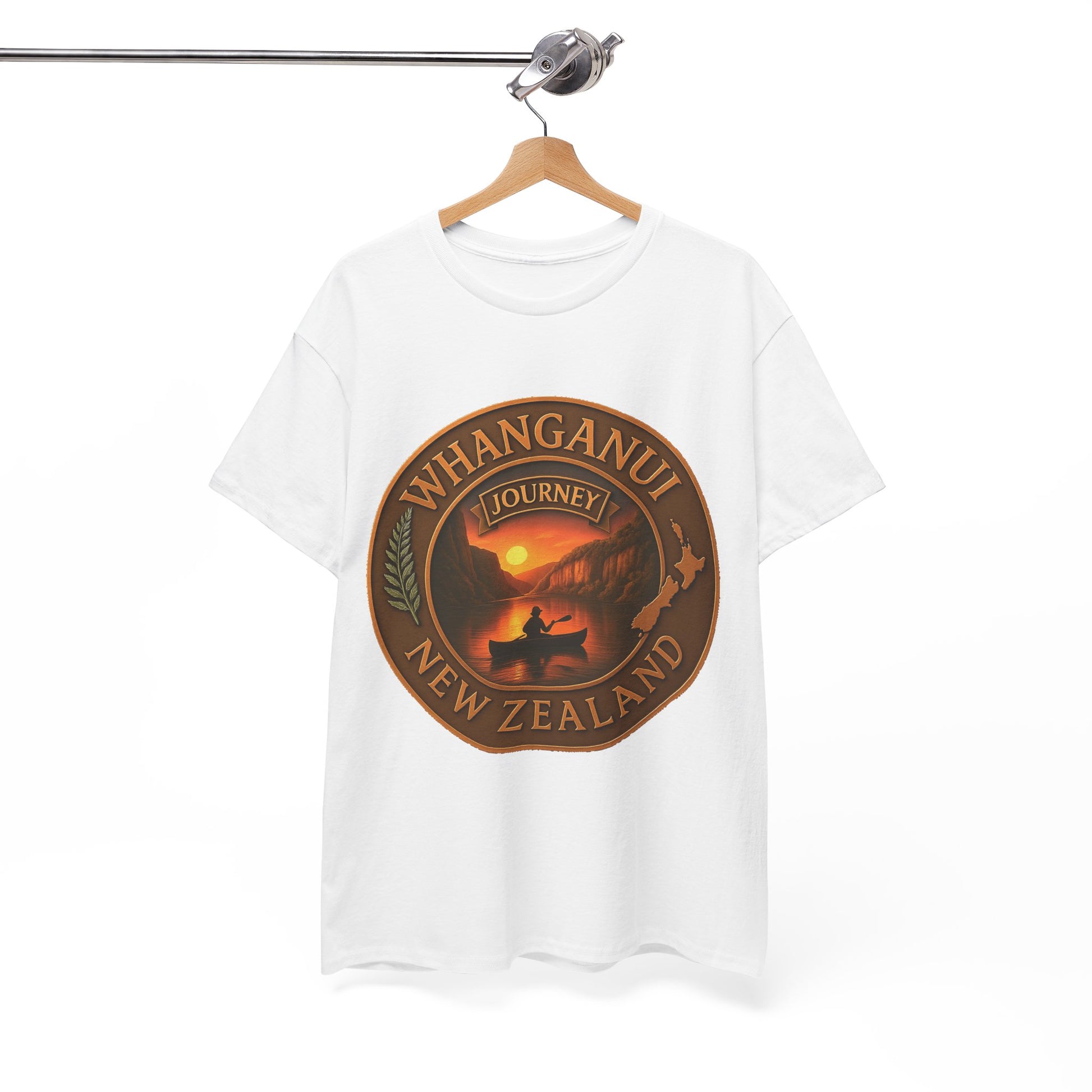 White t-shirt with a brown graphic design featuring 'Whanganui Journey New Zealand' on a hanger against a white background.