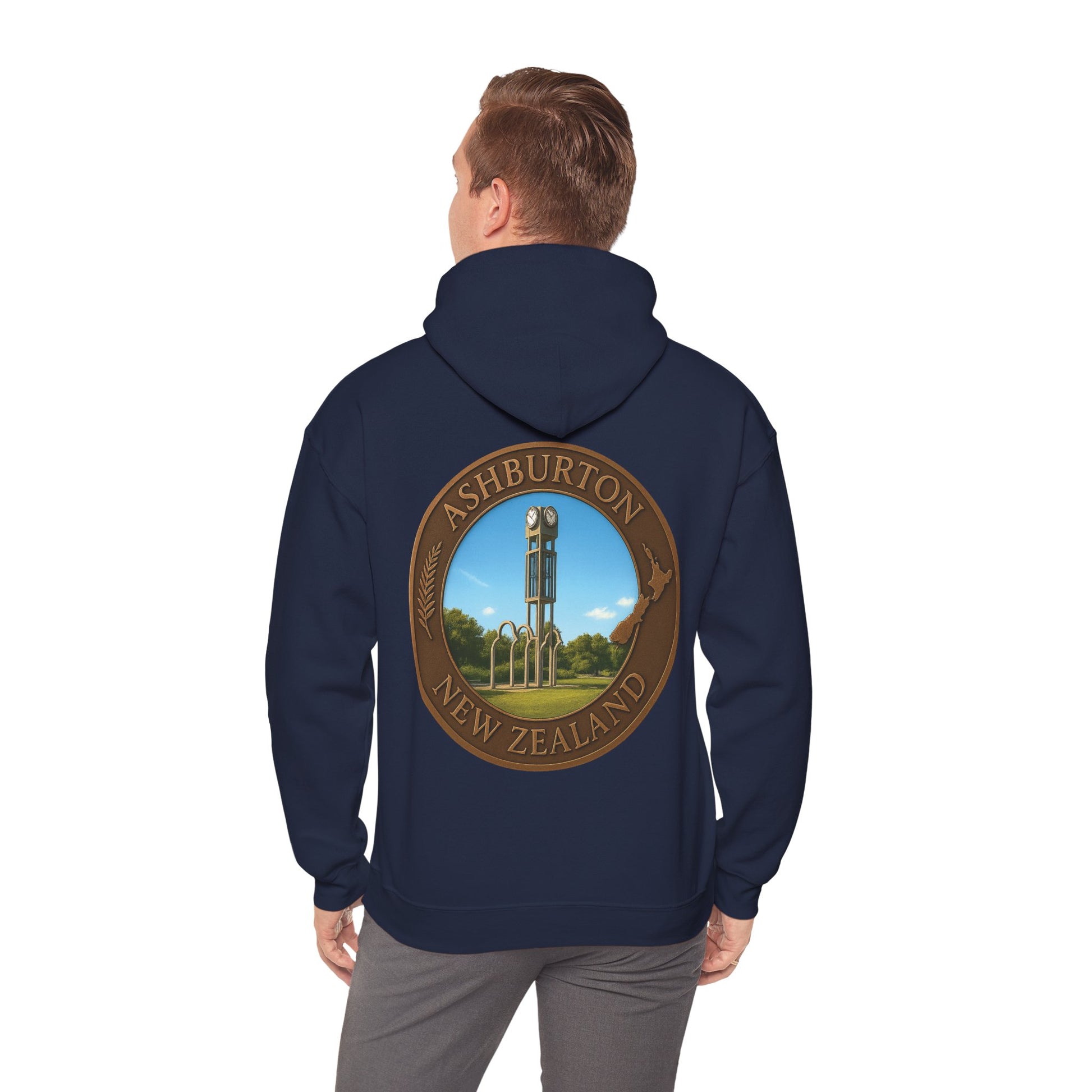 Navy blue Ashburton hoodie with a circular design on the back, featuring a scenic view and text, worn by a person.