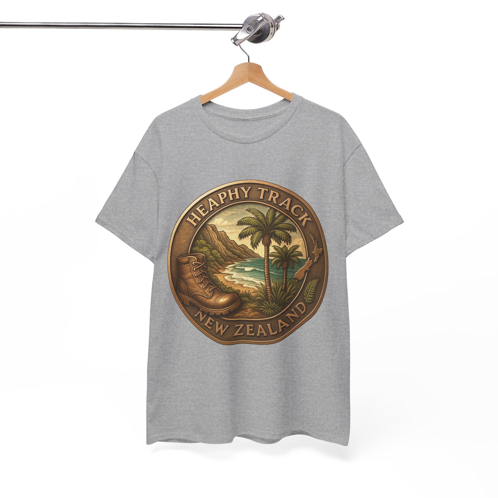 Gray t-shirt with a tropical design and 'Heathy Track New Zealand' text on a hanger against a white background