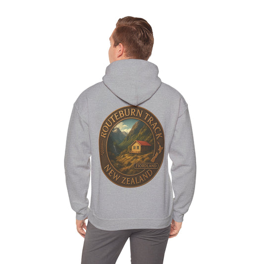Person wearing a gray hoodie with a 'Routeburn Track, New Zealand' design on the back.