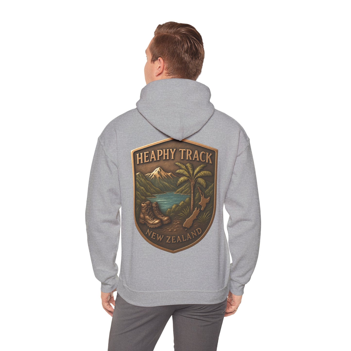 Person wearing a gray Heaphy Track hoodie with a 'Heathy Track New Zealand' logo on the back.