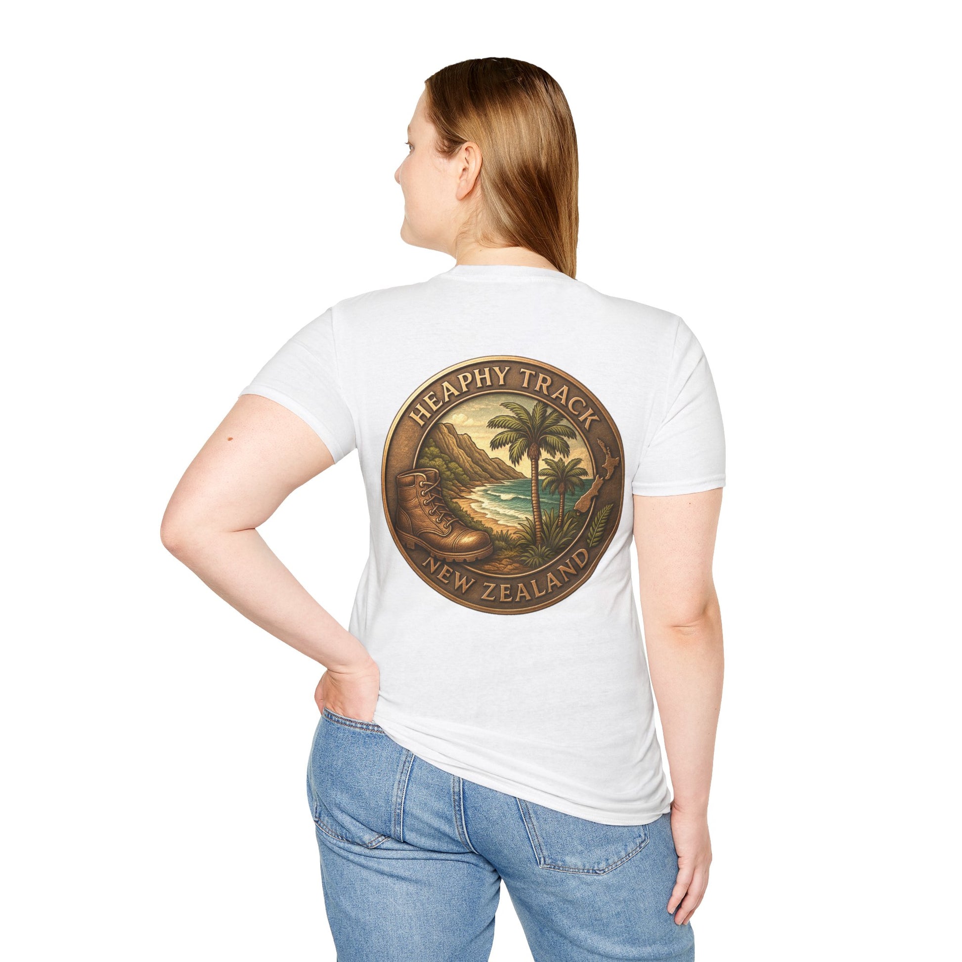 Person wearing a white Heaphy Track t-shirt with a scenic design on the back, standing against a white background