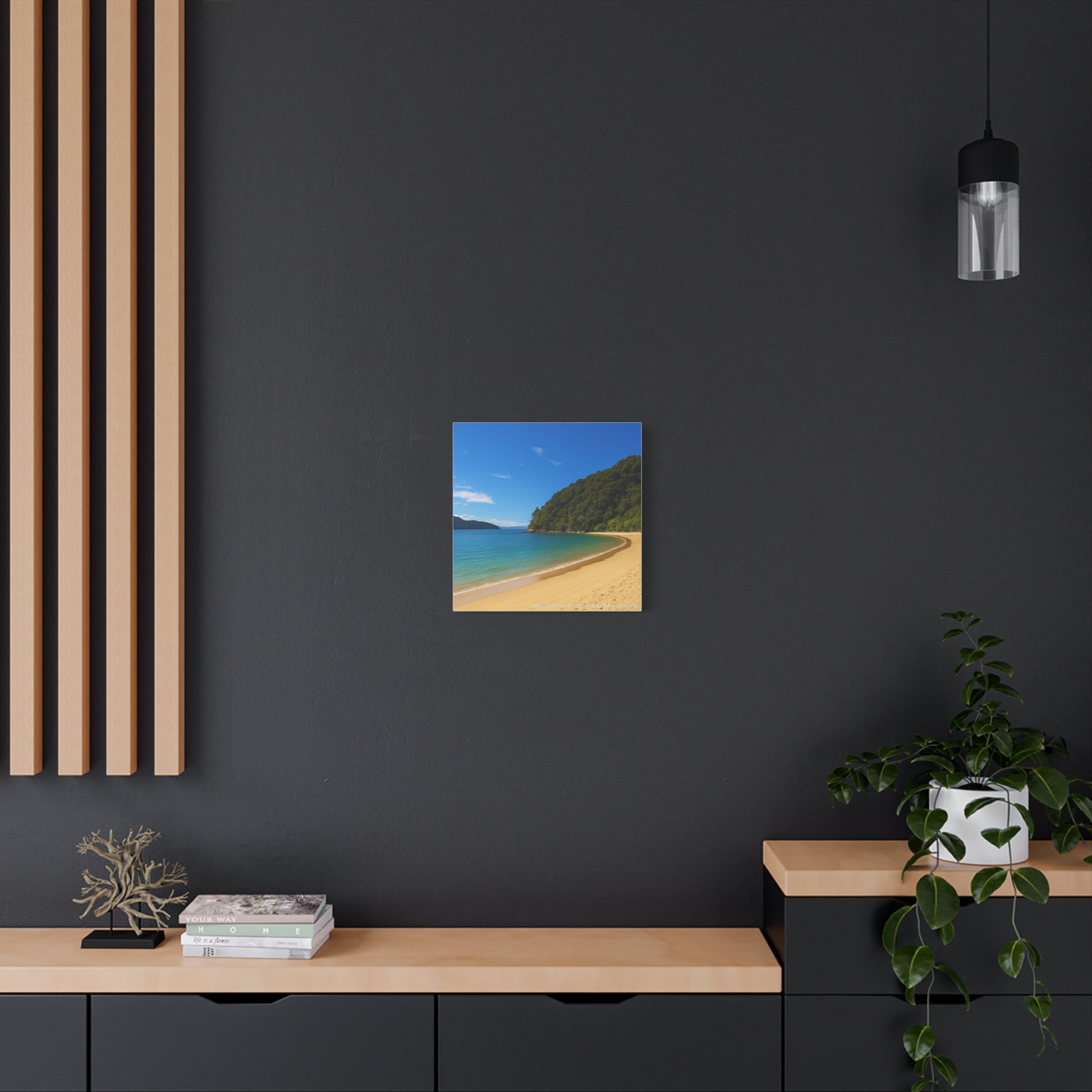 Abel Tasman Beach scene painting on a dark wall with wooden decor elements.