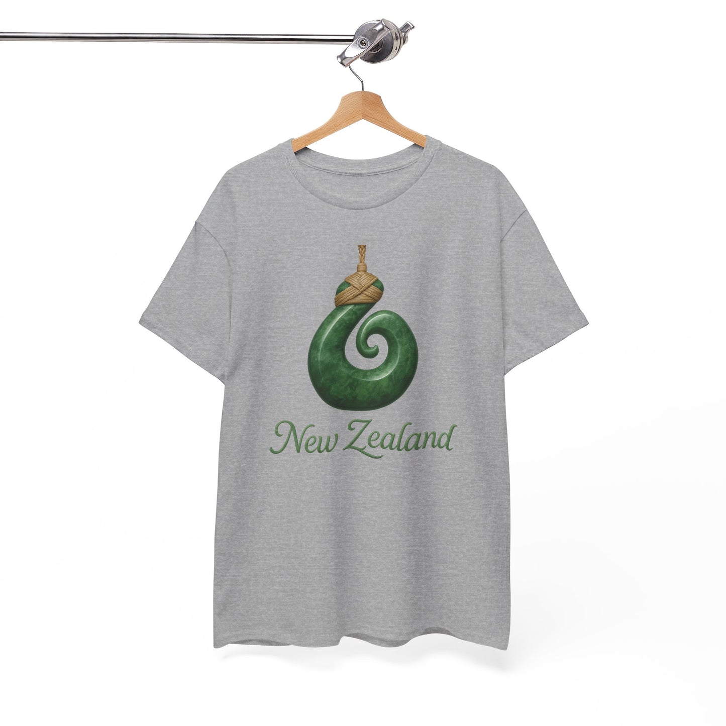 Gray t-shirt with green spiral design and 'New Zealand' text on a hanger against a white background