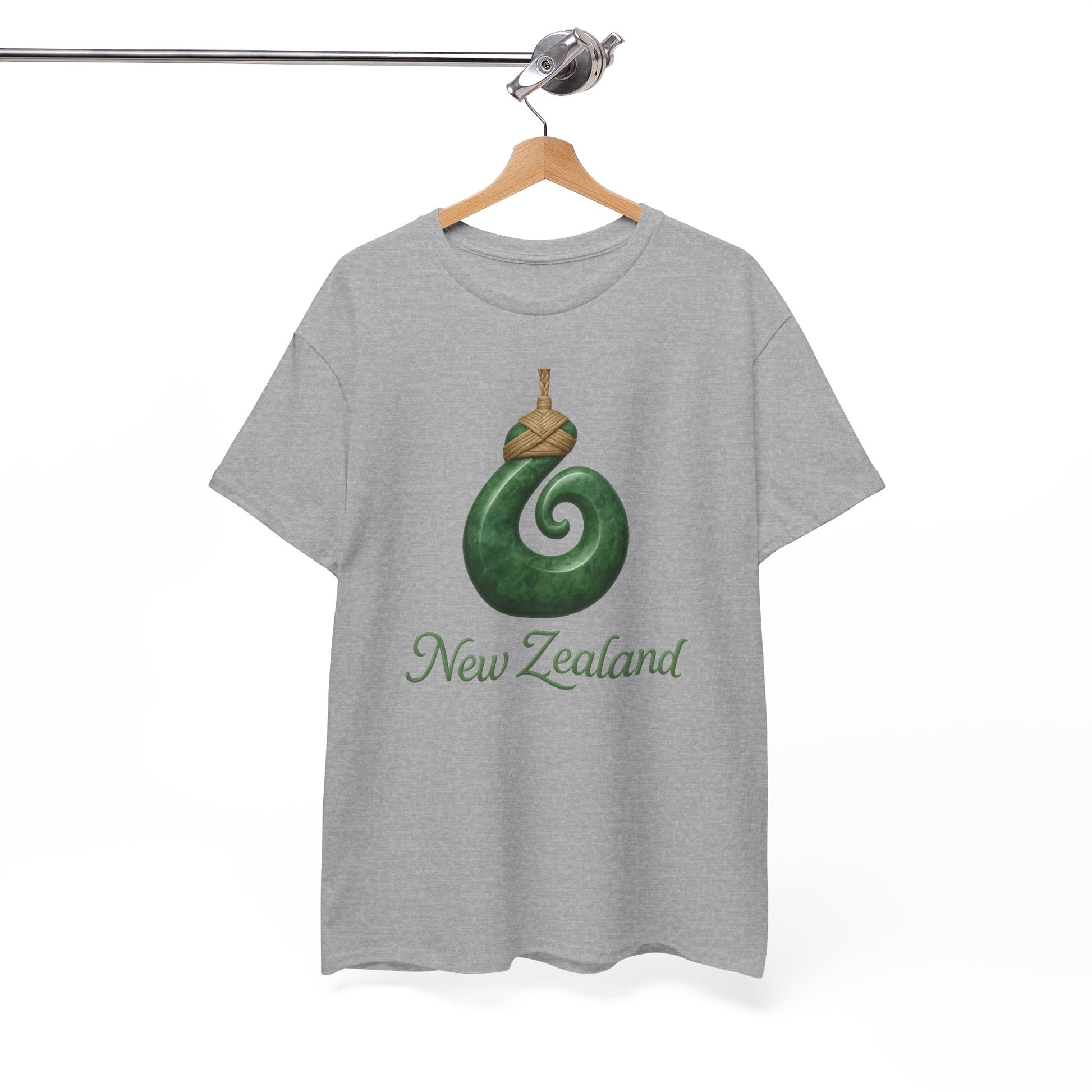 Gray t-shirt with green spiral design and 'New Zealand' text on a hanger against a white background