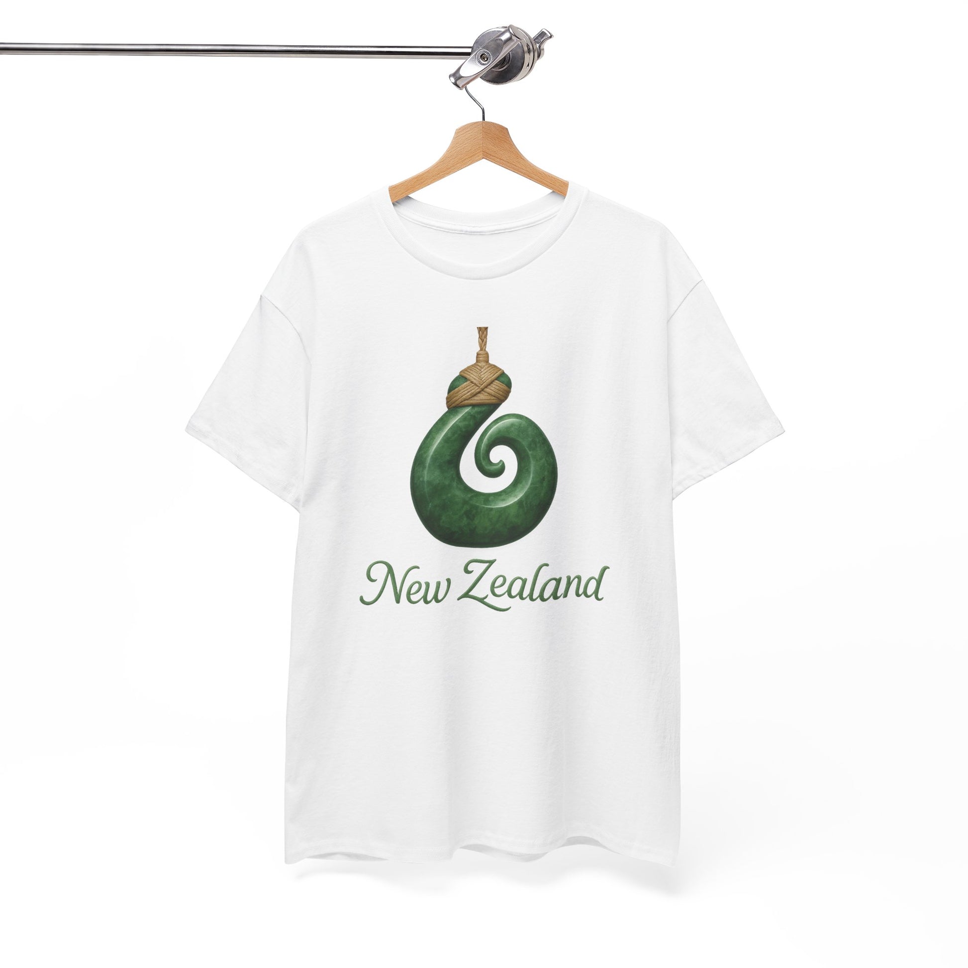 White t-shirt with green spiral design and 'New Zealand' text on a hanger against a white background