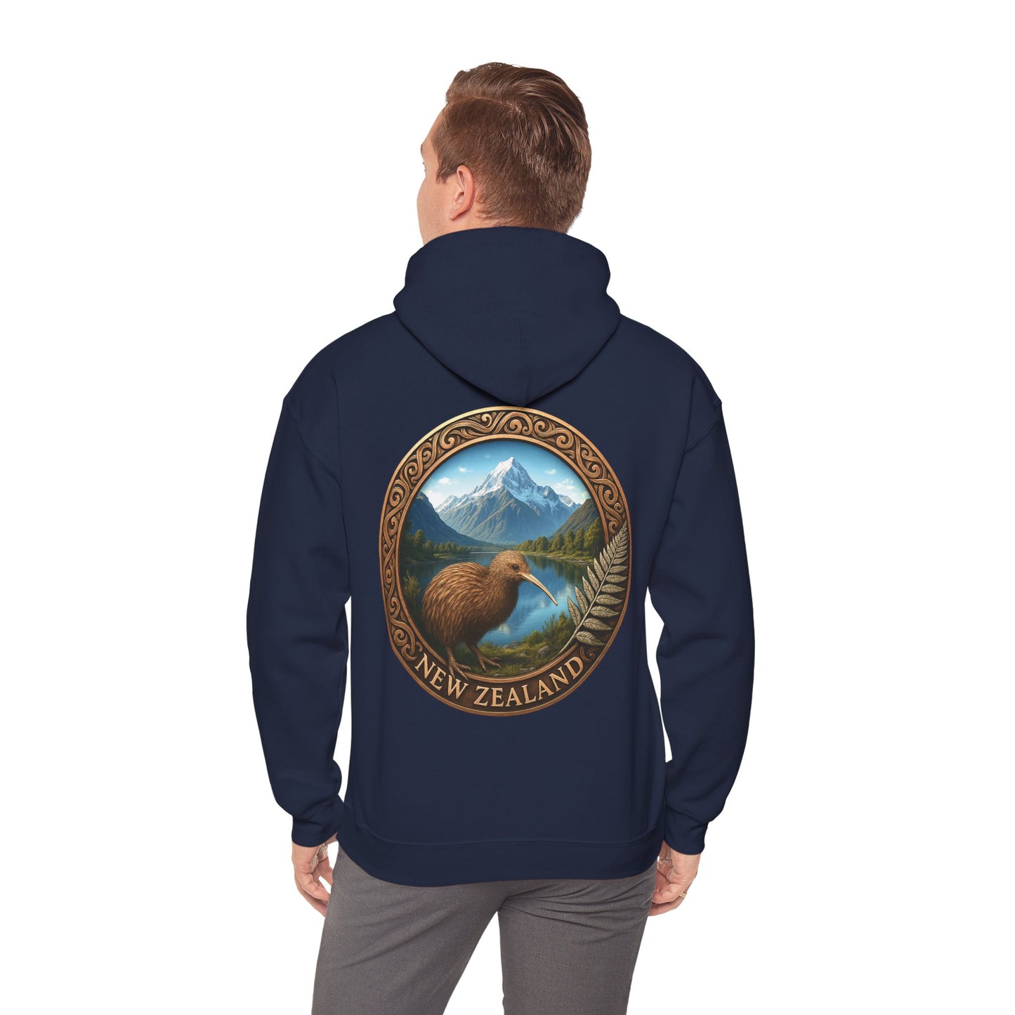 Navy blue NZ hoodie with a Kiwi bird and mountain design on the back, worn by a person.