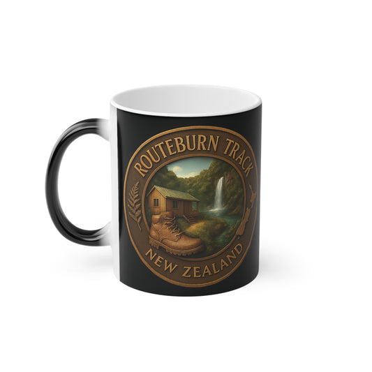 Black Coffee mug with 'Routeburn Track New Zealand' design featuring a cabin and waterfall.