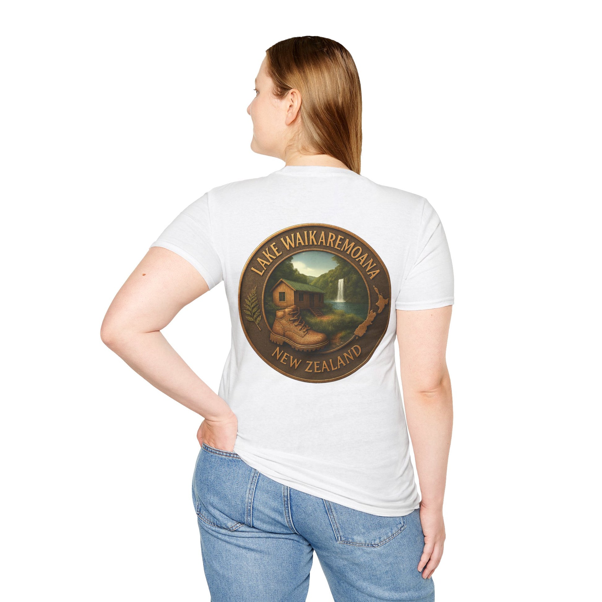 Person wearing a white Lake Waikaremoana Track t-shirt with a circular design on the back, featuring text and an illustration.