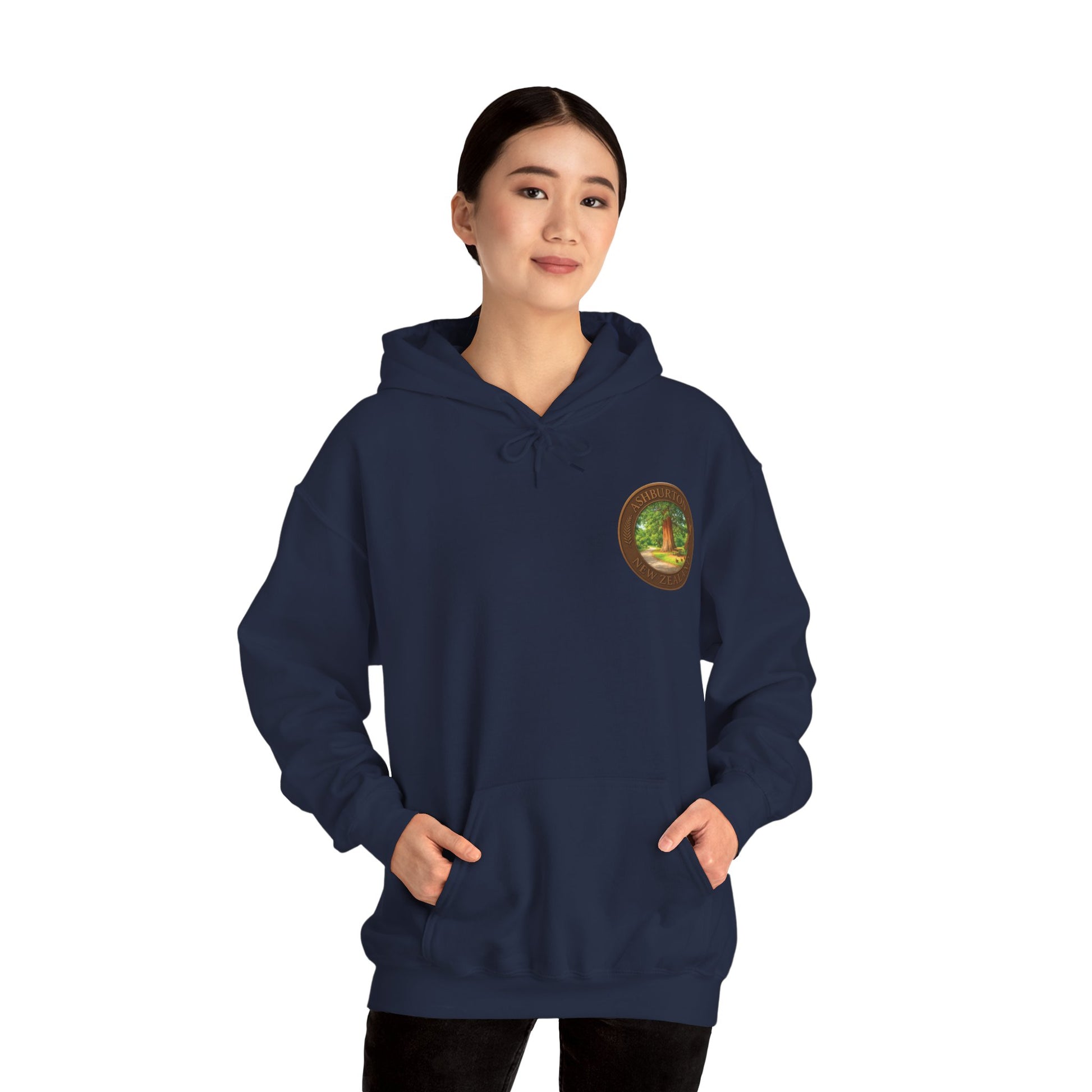 Person wearing a navy blue Ashburton hoodie with a logo on a white background