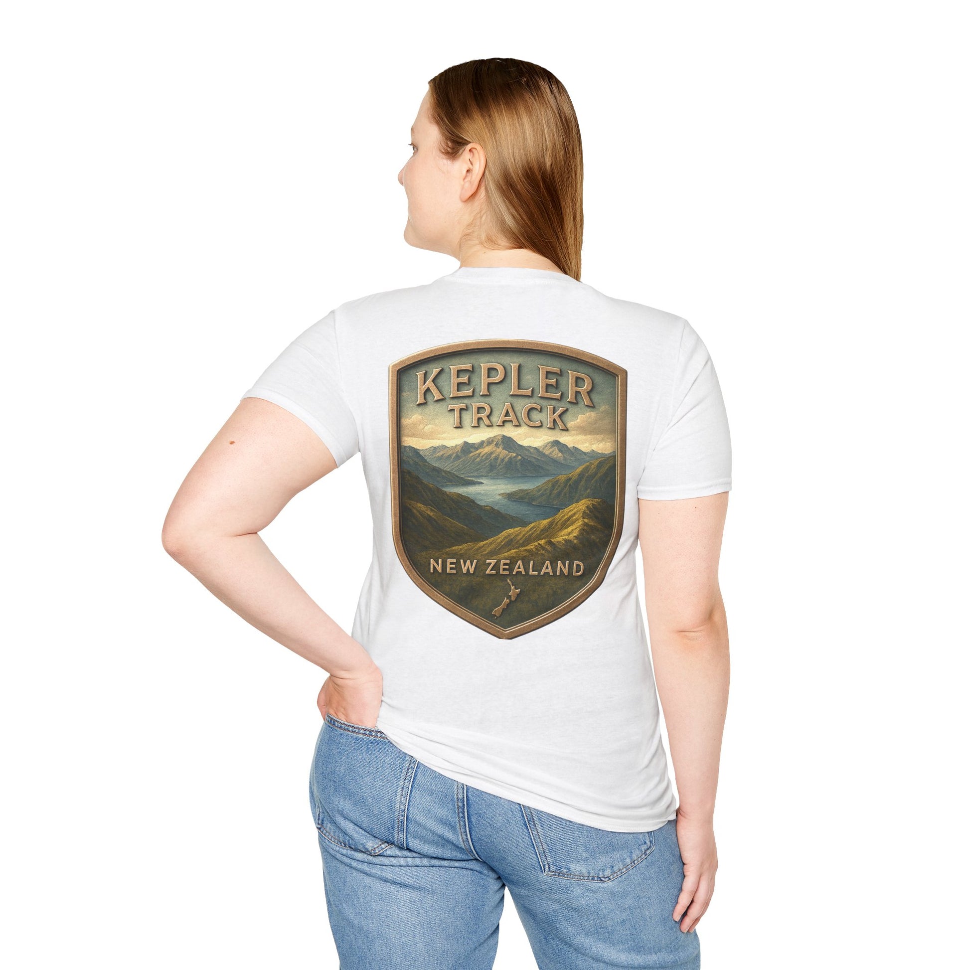 Person wearing a white t-shirt with 'Kepler Track New Zealand' graphic on the back.