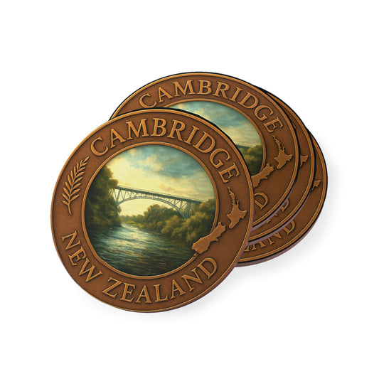 Two round bronze-colored plaques with 'Cambridge New Zealand' text and scenic images on a white background.