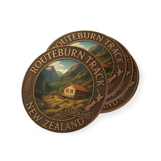 Bronze-colored 'Routeburn Track New Zealand' coin with scenic design on a white background