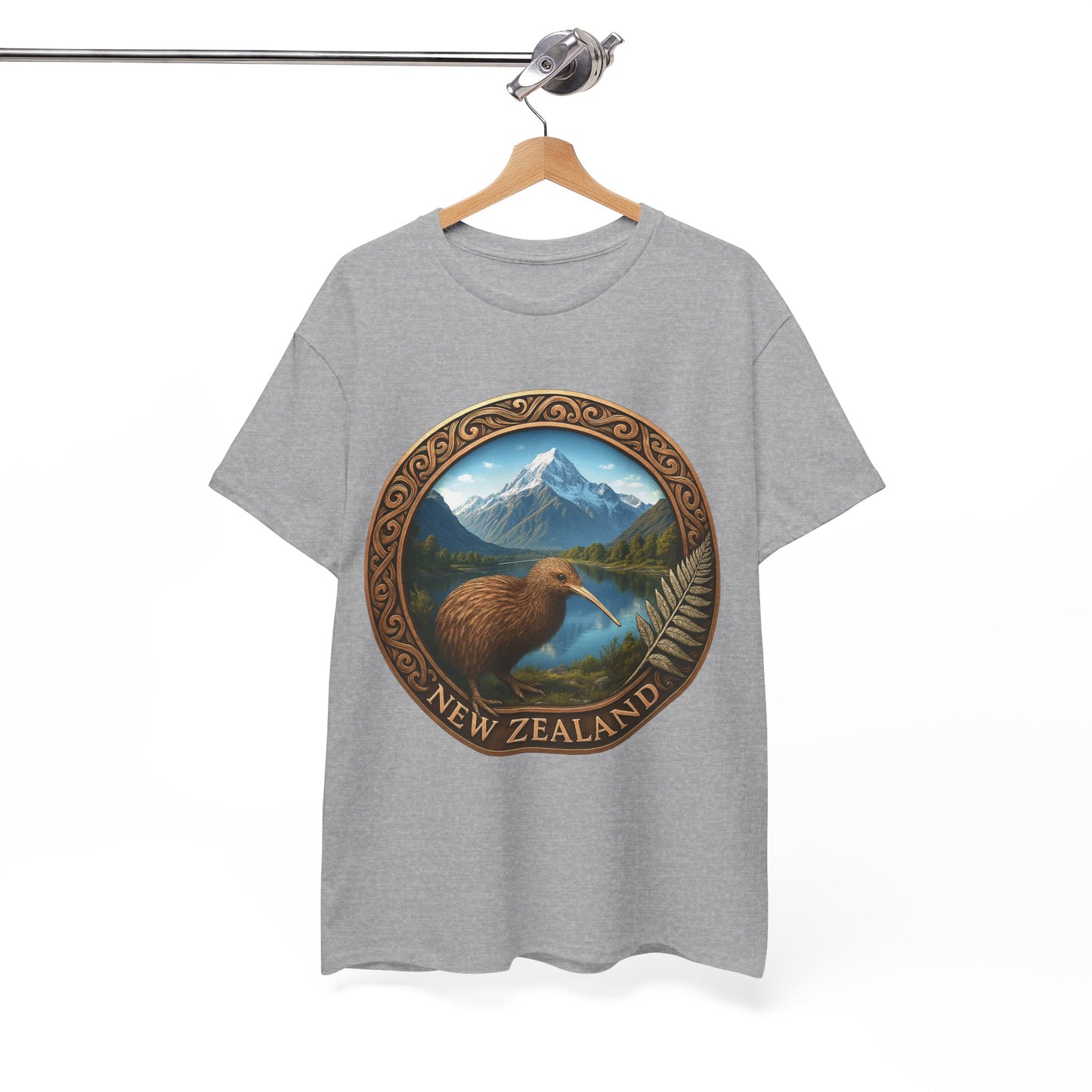 Gray t-shirt with New Zealand design featuring a kiwi bird and mountains on a hanger against a white background.