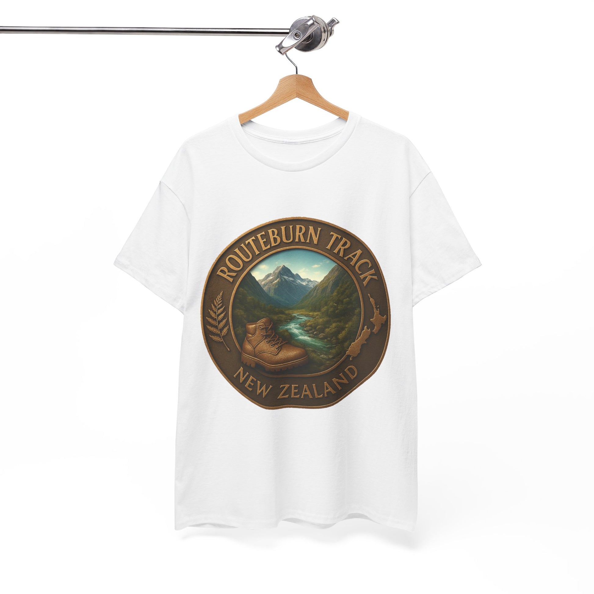 White t-shirt with a scenic design and 'Routeburn Track New Zealand' text on a hanger against a white background