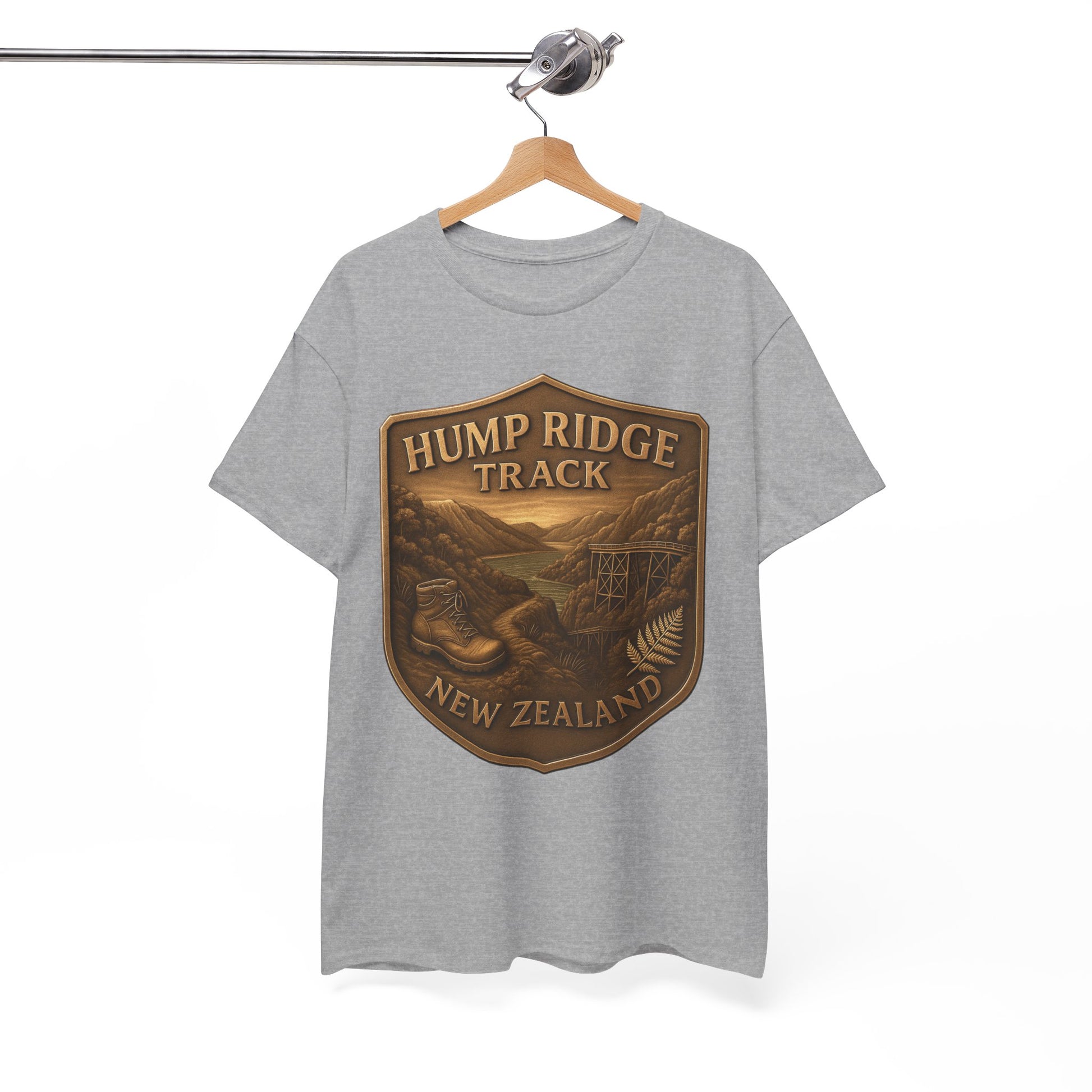 Gray t-shirt with 'Hump Ridge Track, New Zealand' graphic on a hanger against a white background