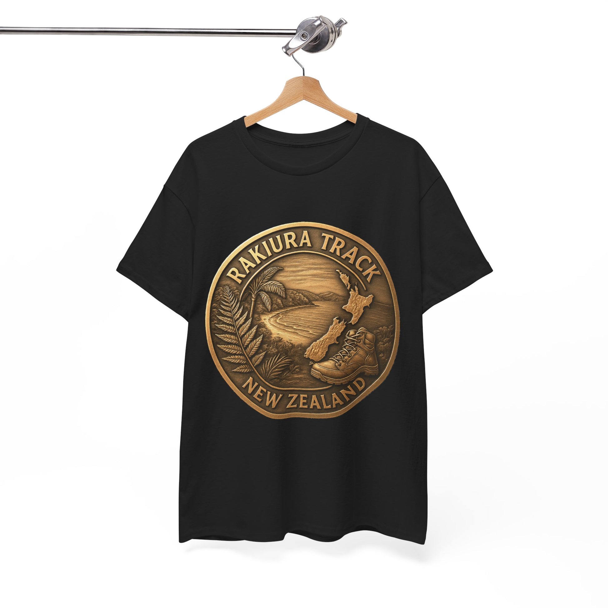 Black t-shirt with a gold 'Rakiura Track New Zealand' design on a hanger against a white background